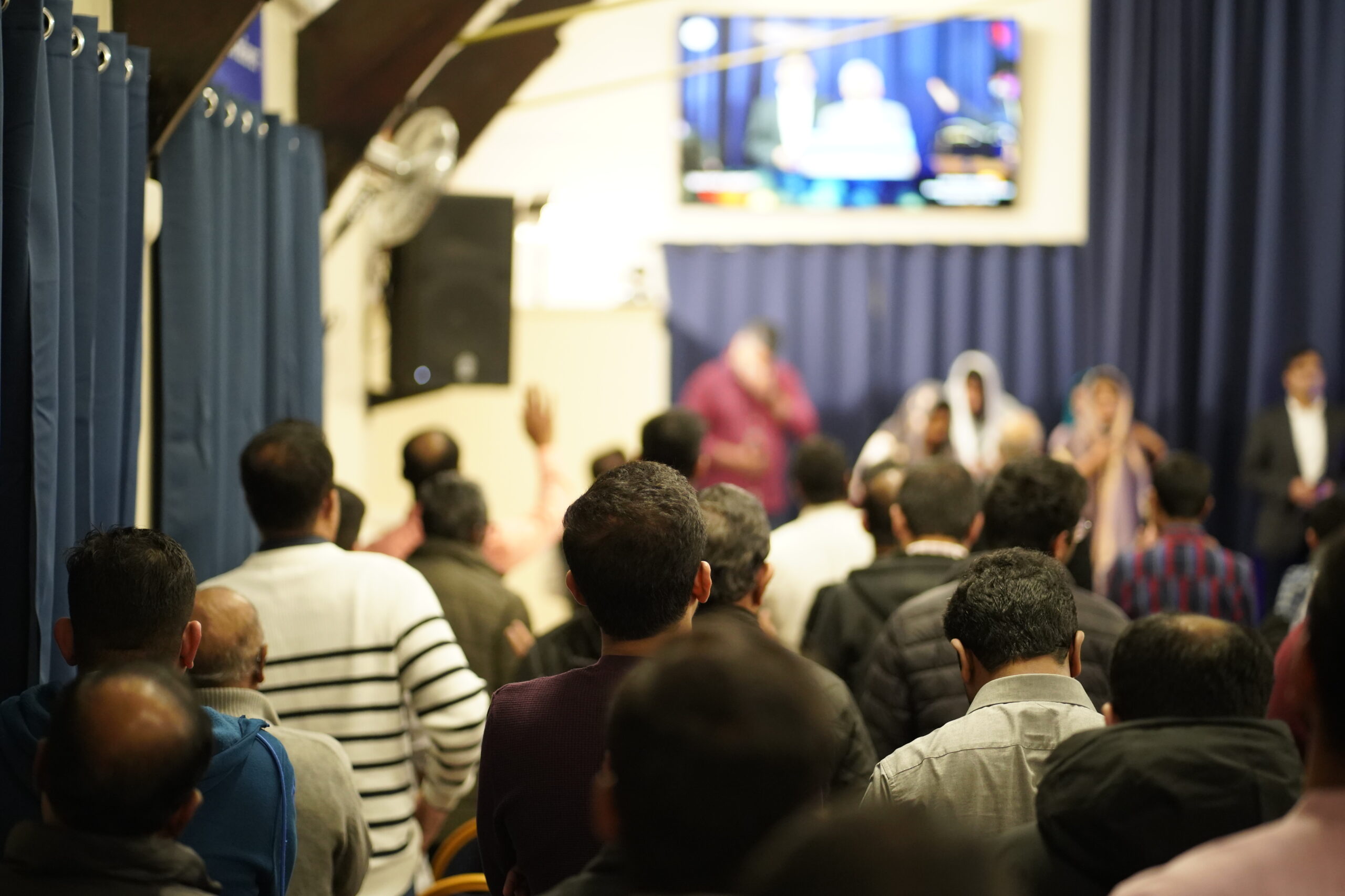 Congregation in prayer and thanksgiving